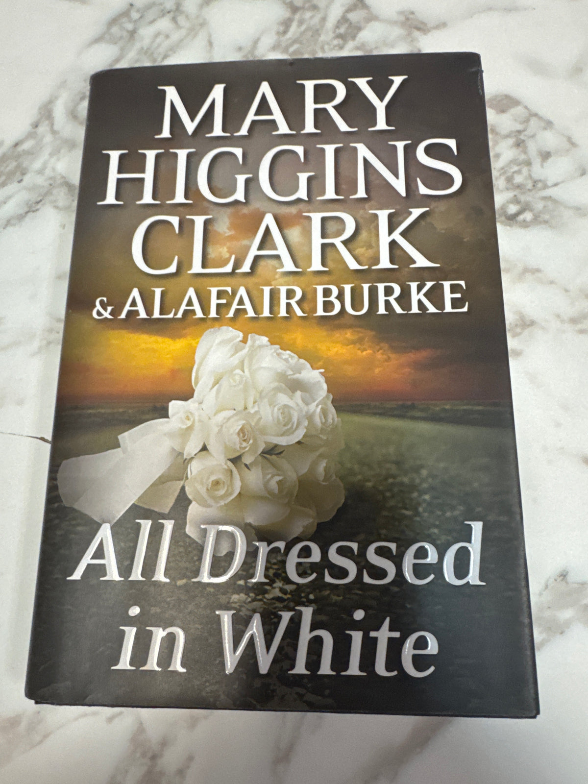 All Dressed in White hardcover book by Mary Higgins Clark with white rose cover art