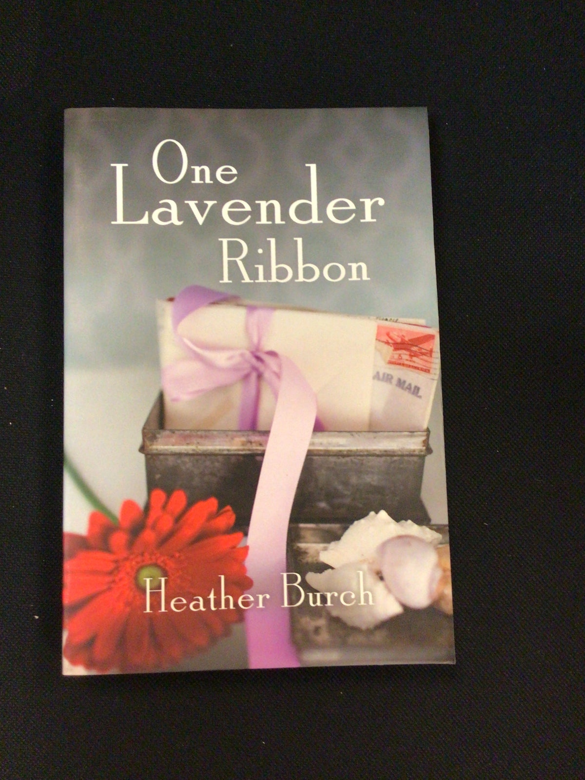 One Lavender Ribbon book cover with vintage tin, lavender ribbon and gerbera daisy