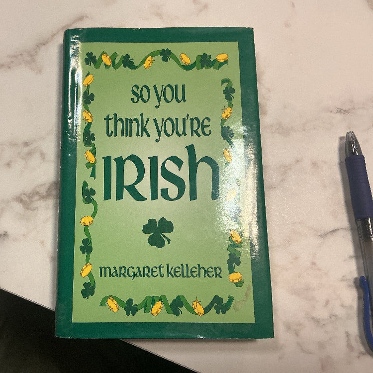 Book titled 'so you think you're Irish' by Margaret Kelleher on a marble surface.