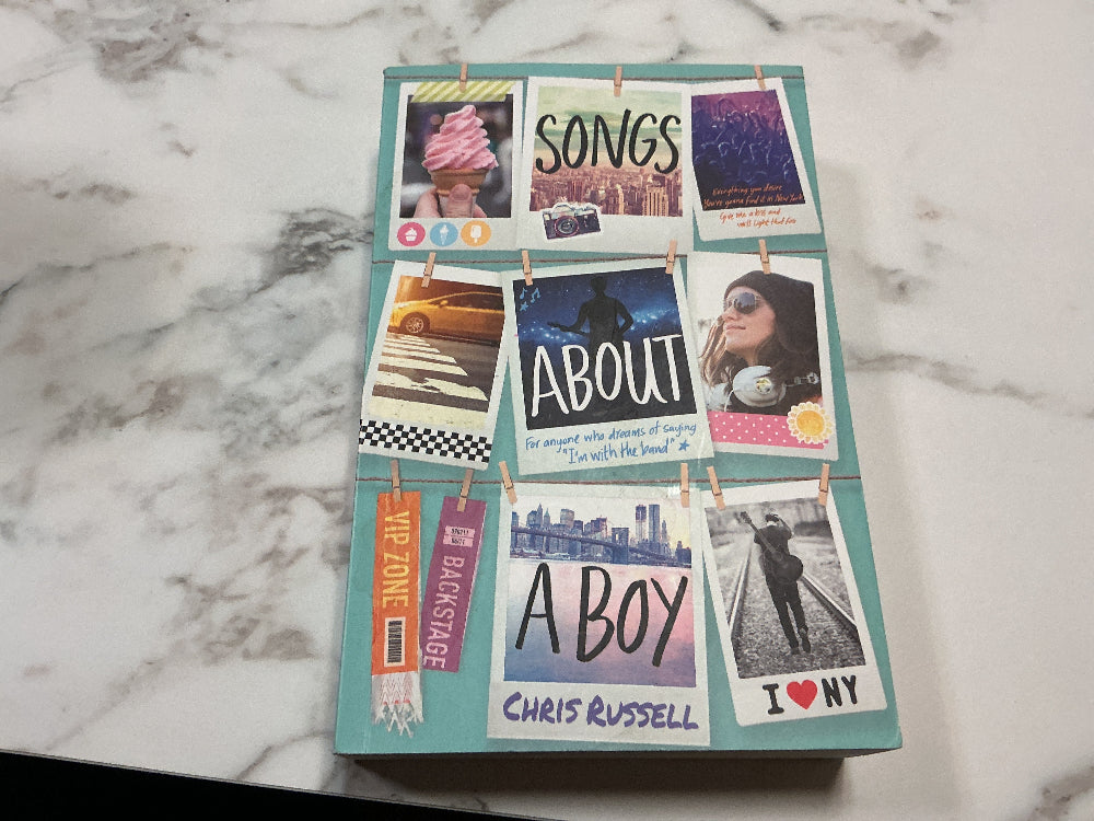 Book titled 'Songs About a Boy' by Chris Russell with photo collage on cover