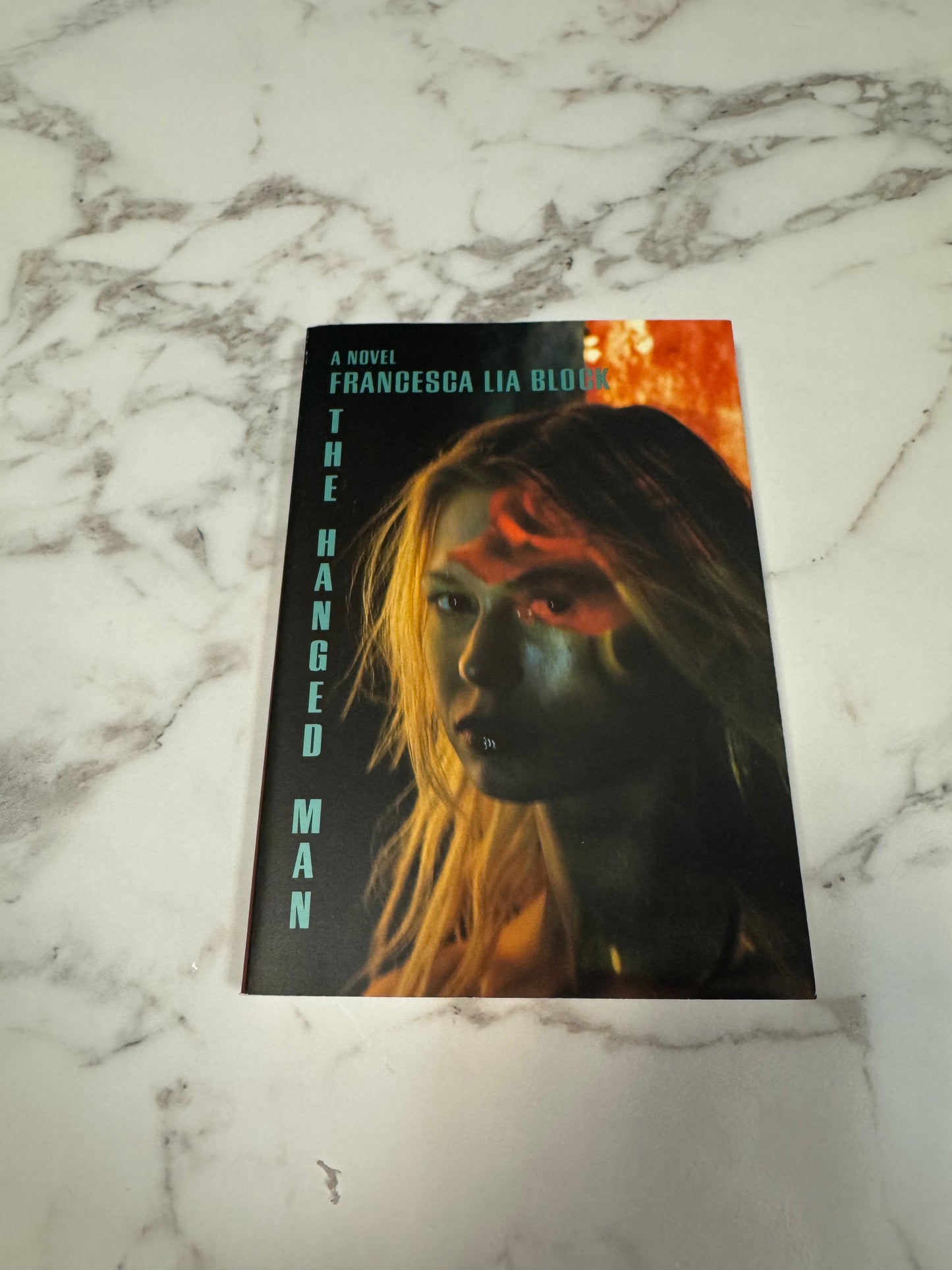 The Hanged Man paperback novel by Francesca Lia Block with blonde woman cover art