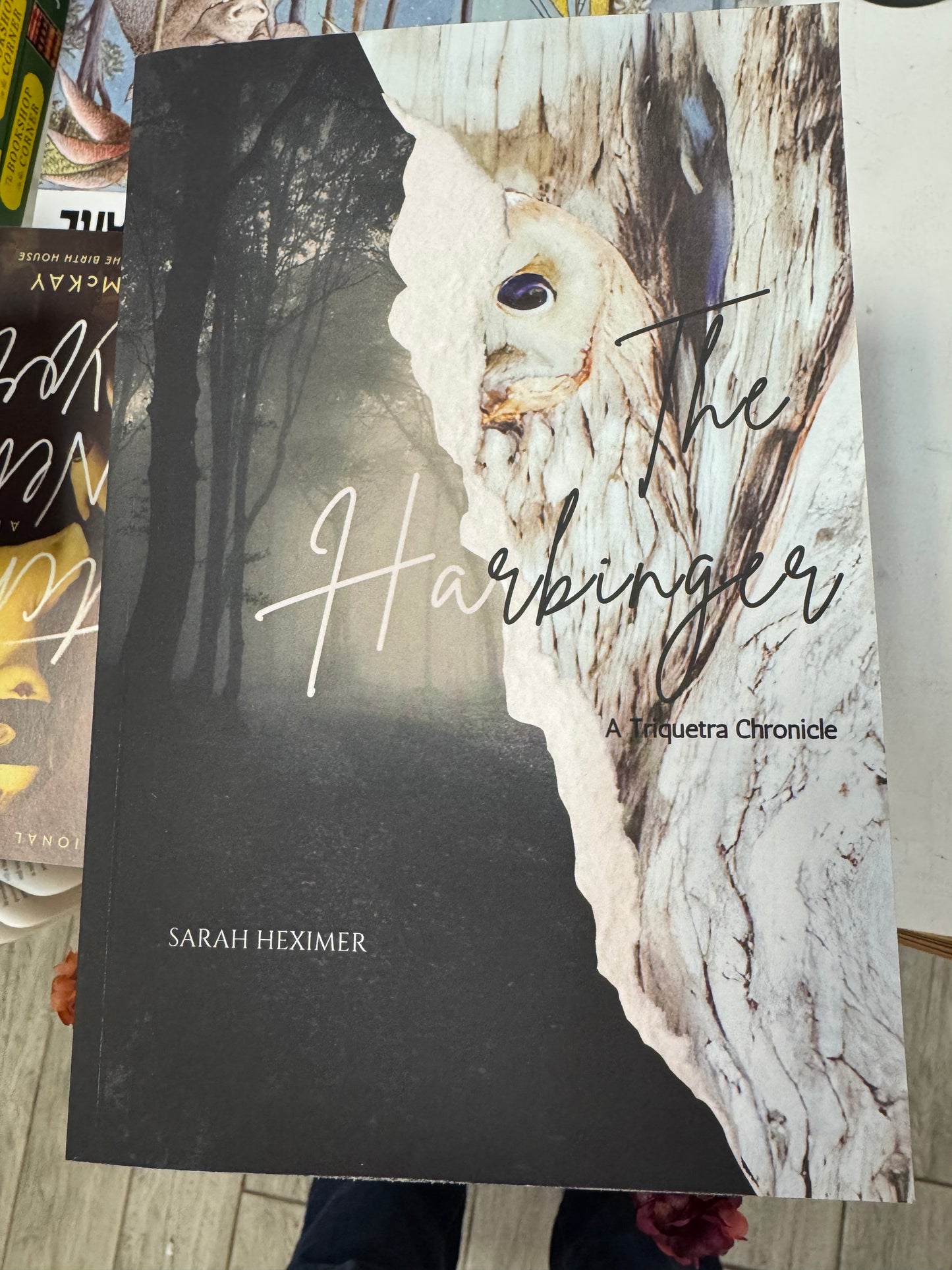 The Harbinger book cover by Sarah Heximer featuring misty forest and white owl design