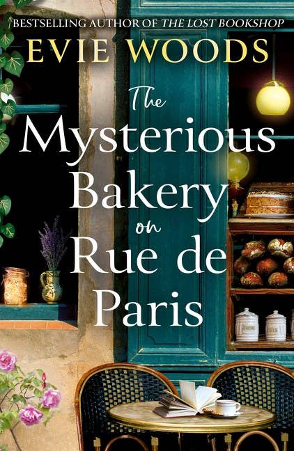 The Mysterious Bakery on Rue de Paris paperback by Evie Woods, featuring teal bakery door cover art