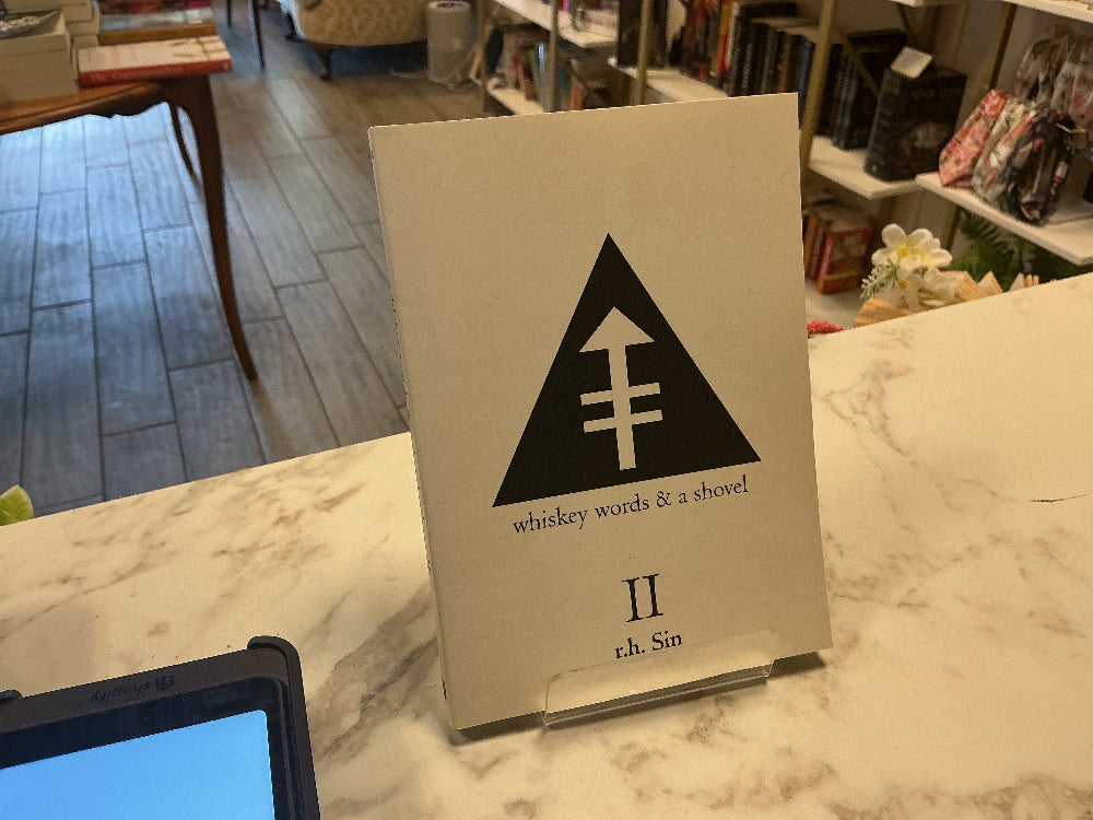 A book titled 'whiskey words & a shovel' by 'r.h.