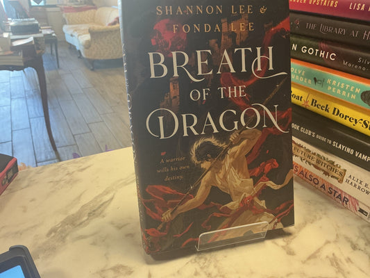 Breath of the Dragon hardcover book by Shannon Lee and Fonda Lee on display stand