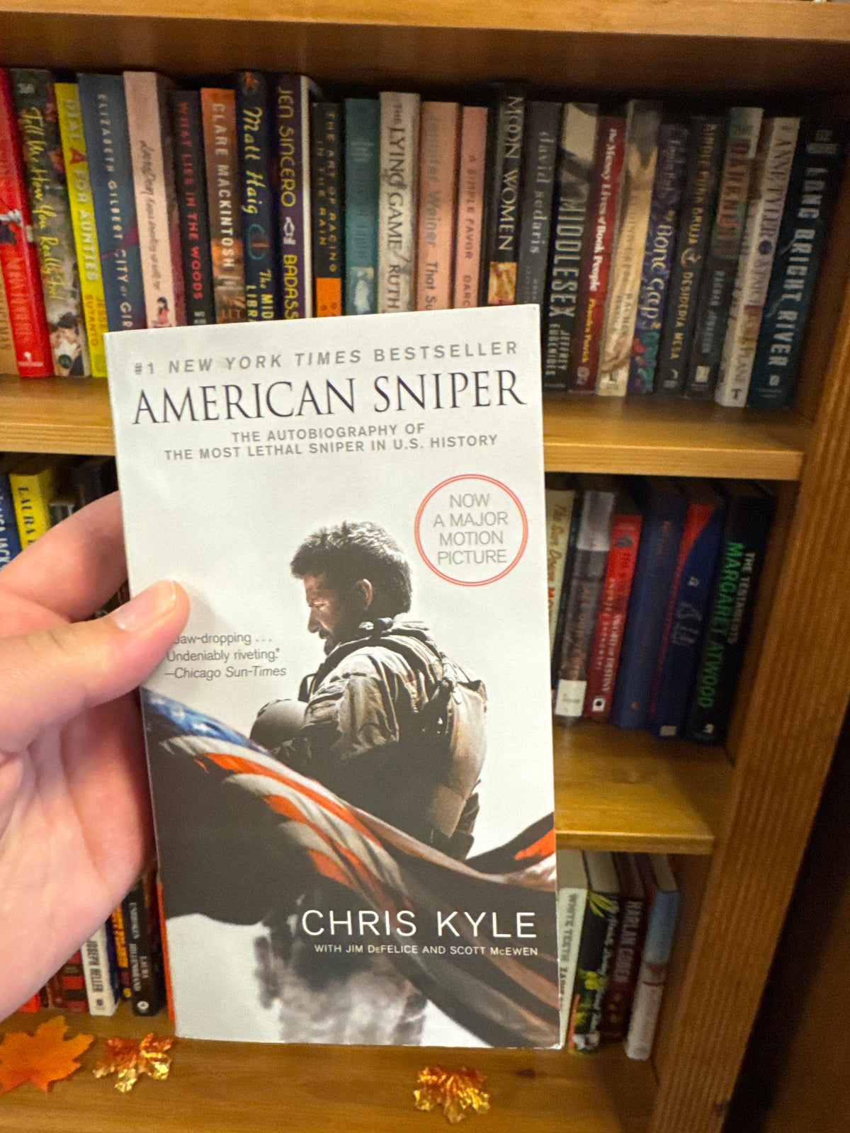 American Sniper paperback by Chris Kyle, New York Times Bestseller cover with military flag design