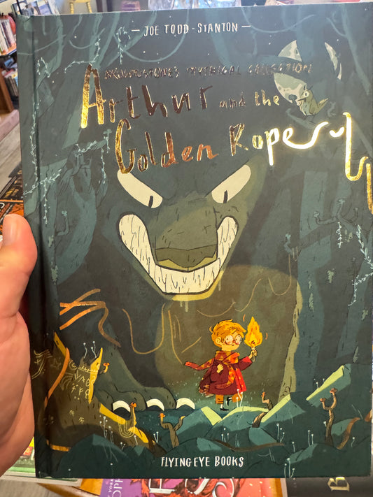 Arthur and the Golden Rope hardcover book by Joe Todd-Stanton, dark green illustrated cover with monster face