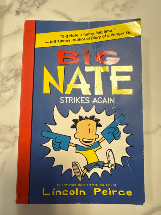 Big Nate Strikes Again paperback book by Lincoln Peirce with cartoon cover art