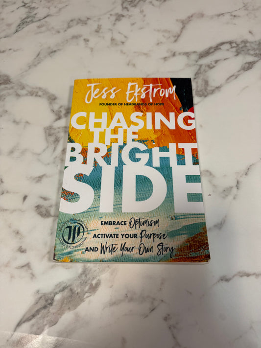 Chasing the Bright Side paperback by Jess Ekstrom with orange teal brushstrokes cover