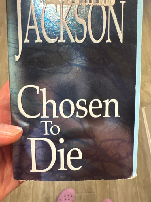 Chosen to Die paperback book by Jackson with dark blue cover and tree branch design