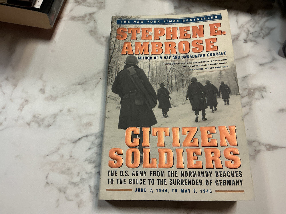 Book titled 'Citizen Soldiers' by Stephen E. Ambrose on a marble surface