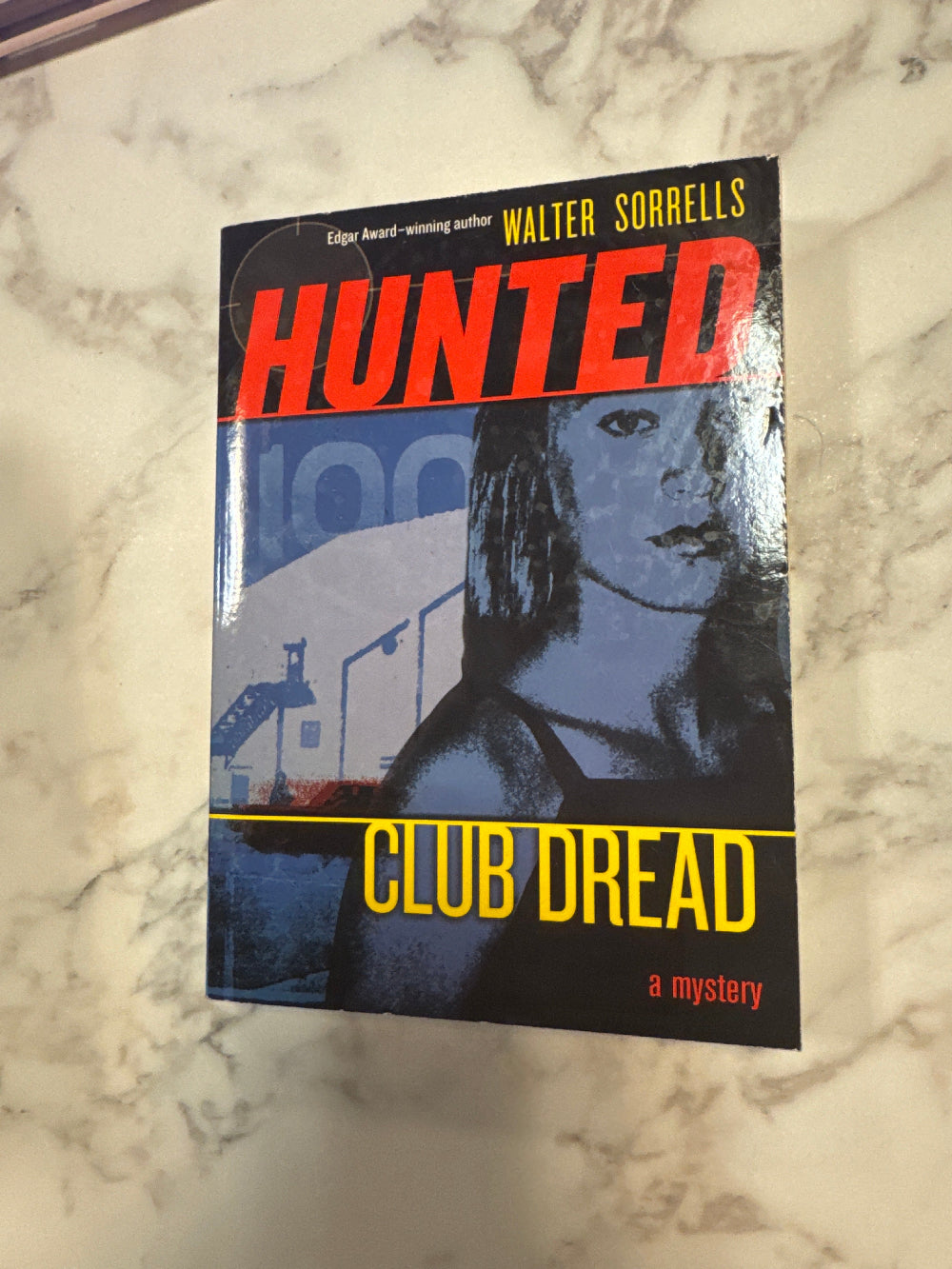 Book titled 'Club Dread' by Walter Sorel on a marble surface
