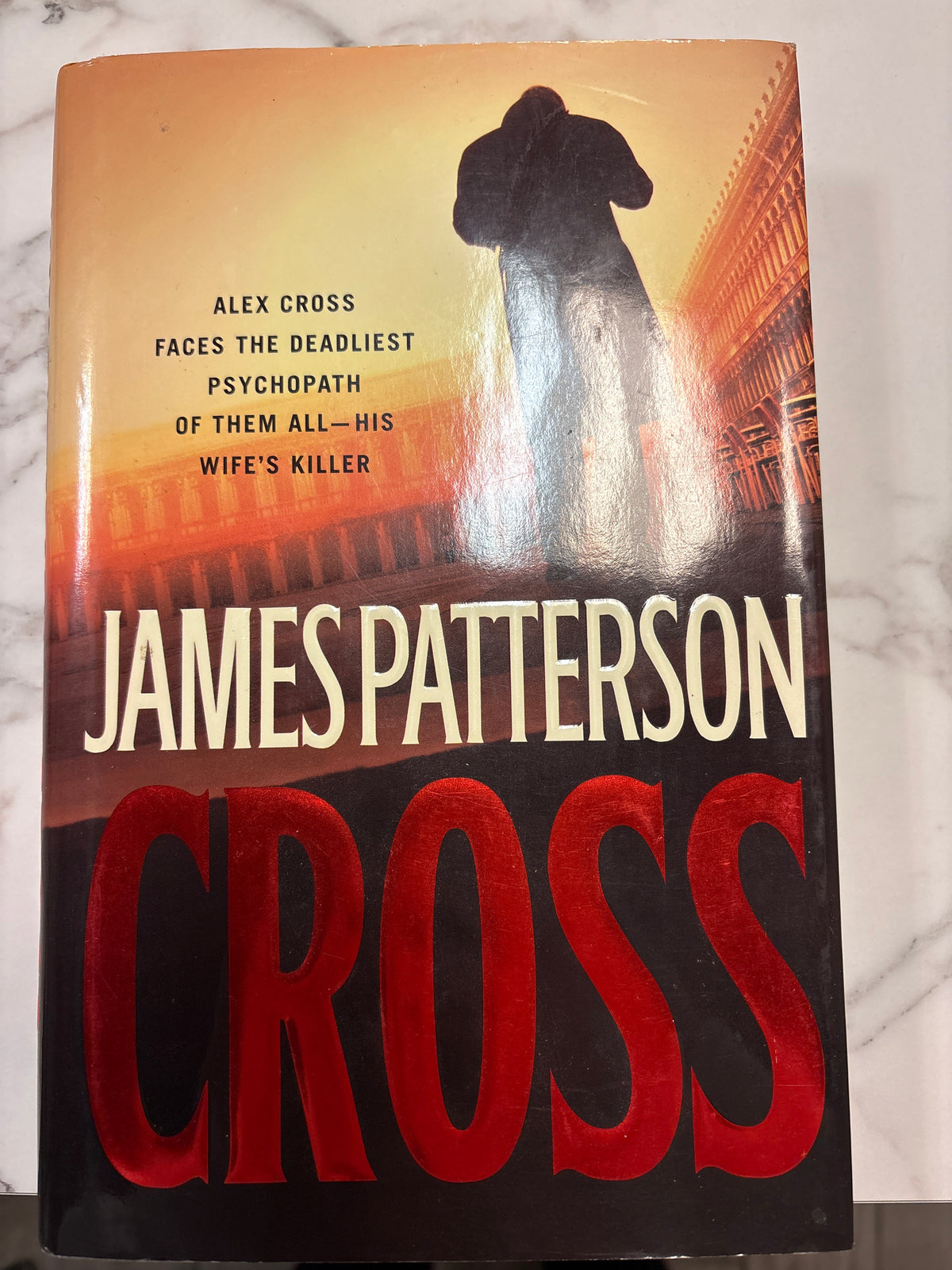 Cross thriller novel by James Patterson hardcover with orange gradient cover art