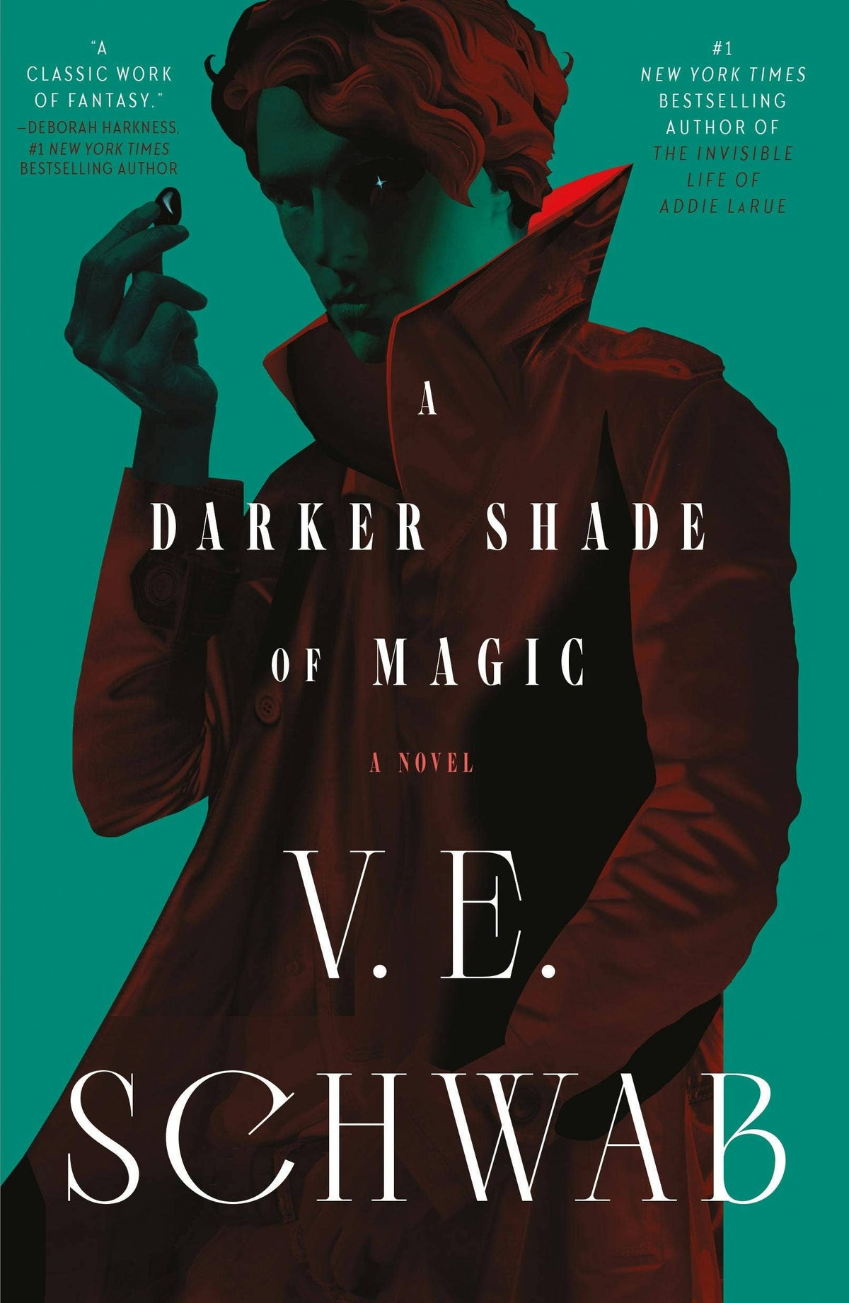 A Darker Shade of Magic trade paperback novel by V.E. Schwab with teal cover art