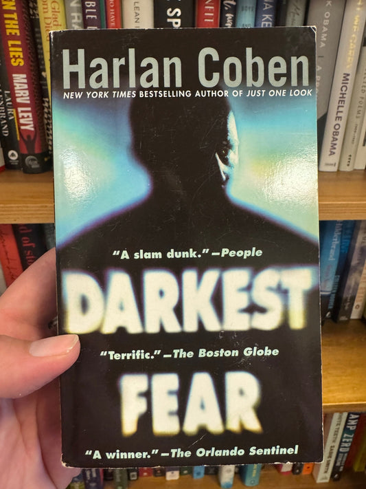 Darkest Fear paperback by Harlan Coben with black cover and silhouetted figure