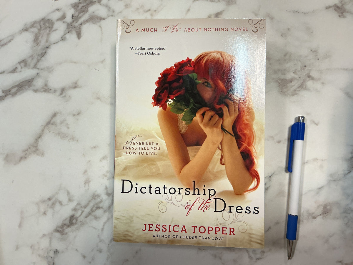 Dictatorship of the Dress hardcover book by Jessica Topper with red-haired woman cover art