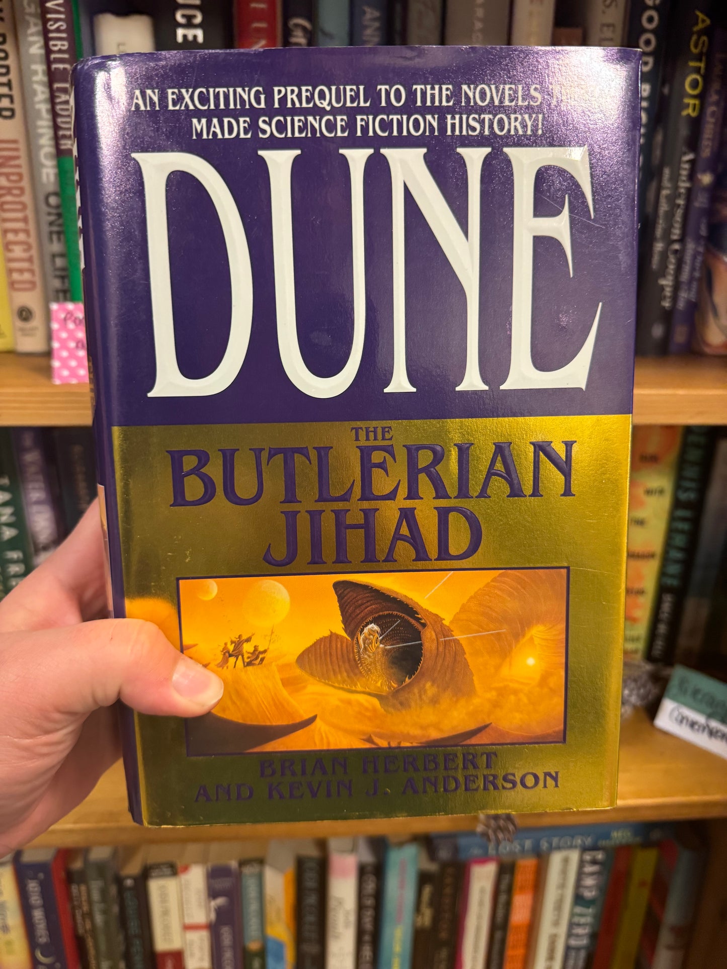 Dune The Butlerian Jihad hardcover book with purple and gold cover art