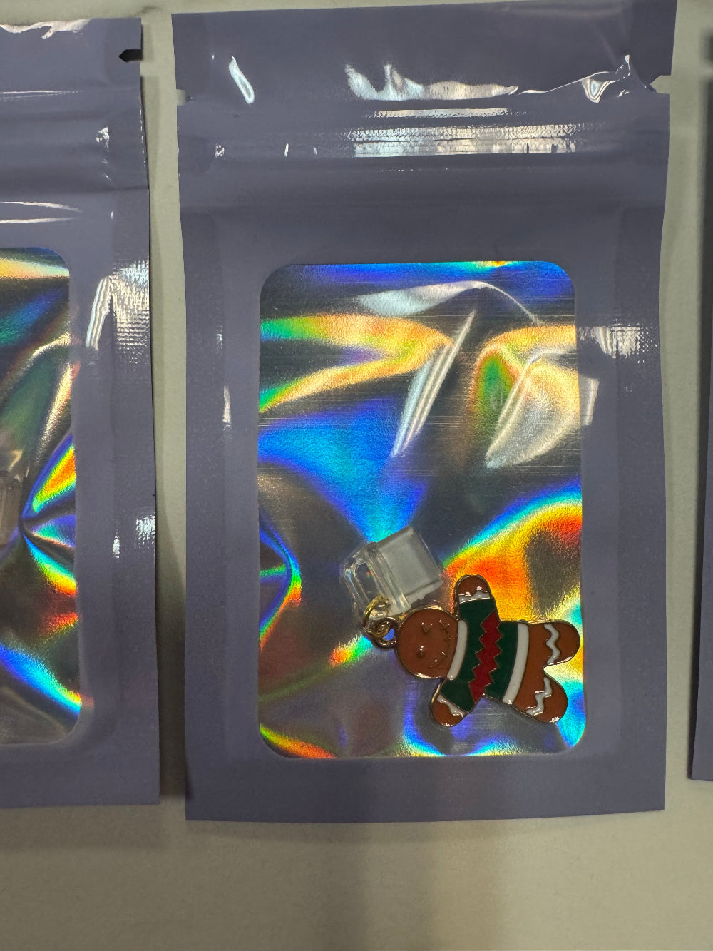 Holographic Packaging with Gingerbread Man Kindle Charm inside