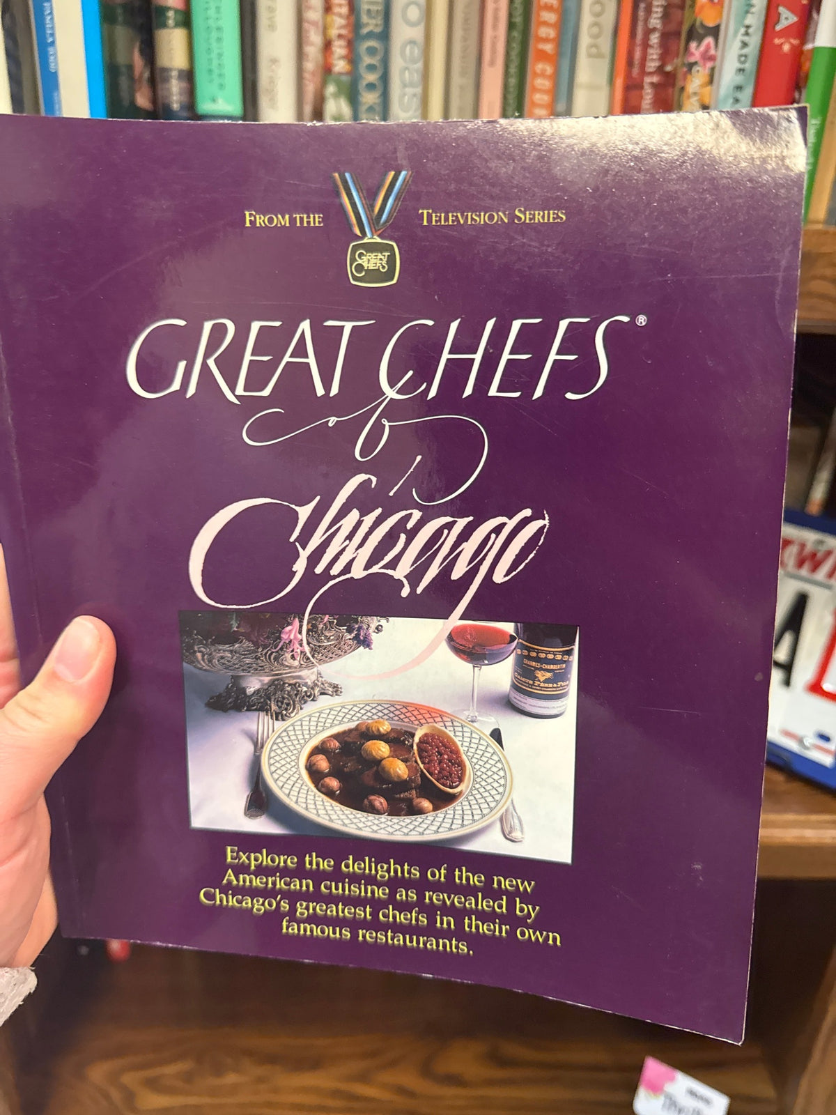 Great Chefs of Chicago cookbook by The Velvet Bookmark, purple hardcover with gold medal logo and New American cuisine recipes