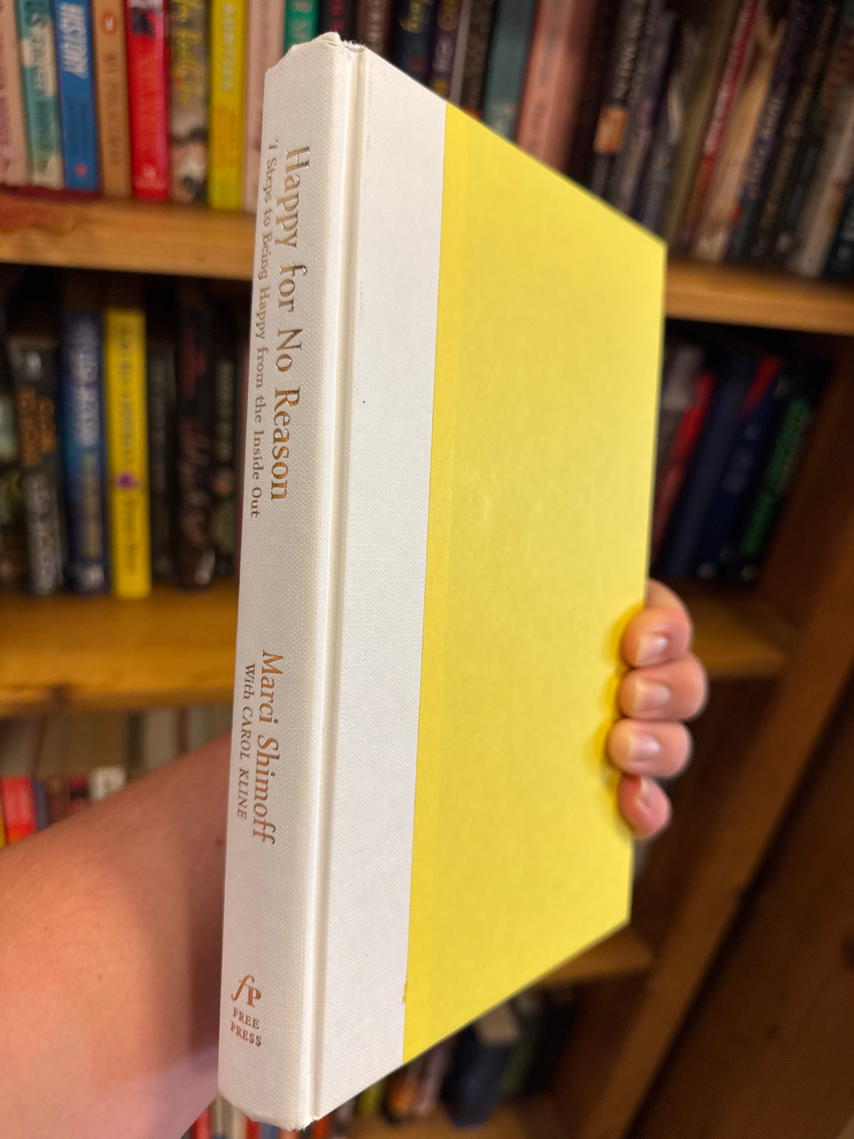 Happy for No Reason hardcover book by Marci Shimoff with yellow cover