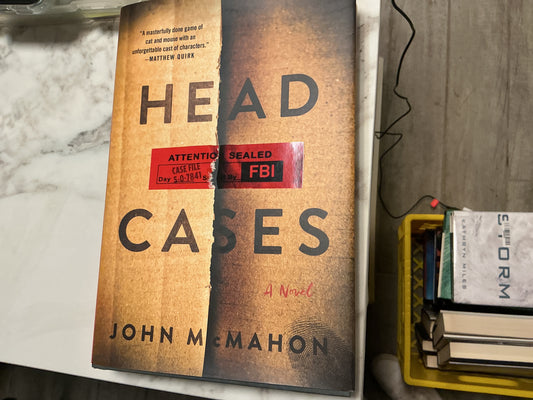 Head Cases hardcover book by John McMahon with tan textured cover and red FBI seal