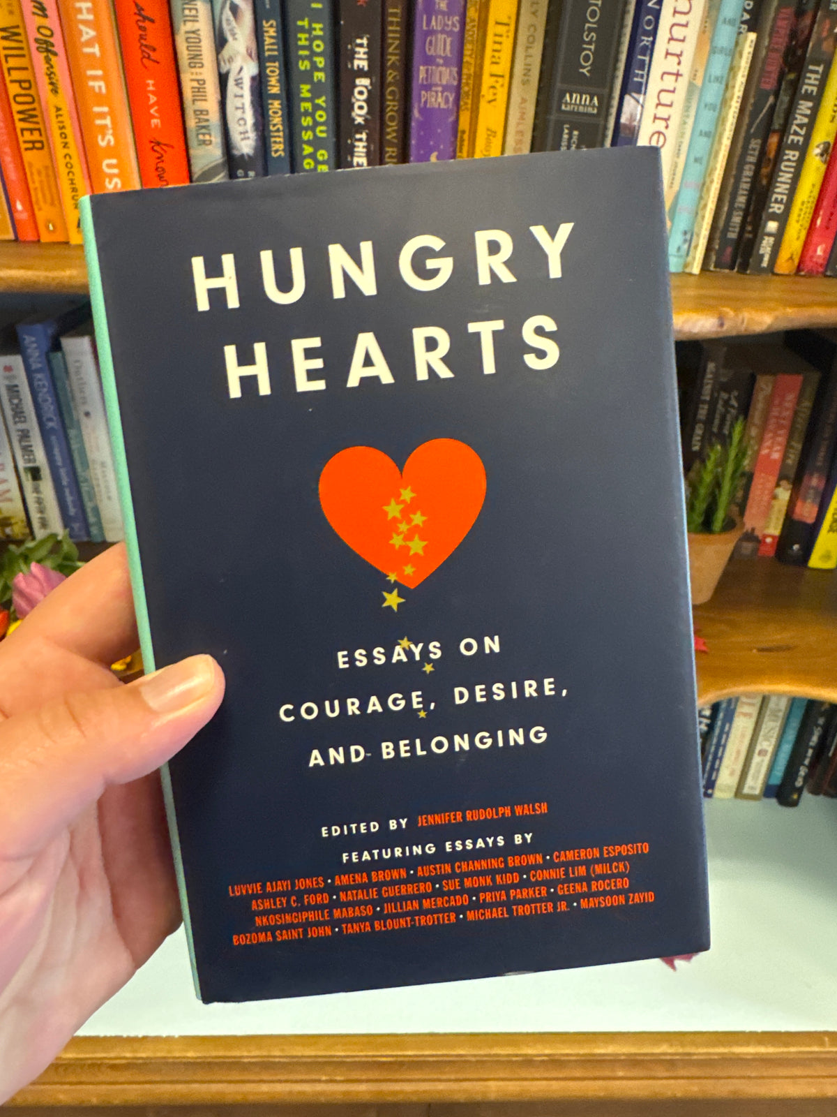 Navy blue hardcover book Hungry Hearts essays on courage desire and belonging by Jennifer Rudolph Walsh