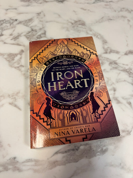 Iron Heart paperback book by Nina Varela with ornate copper and gold cover design