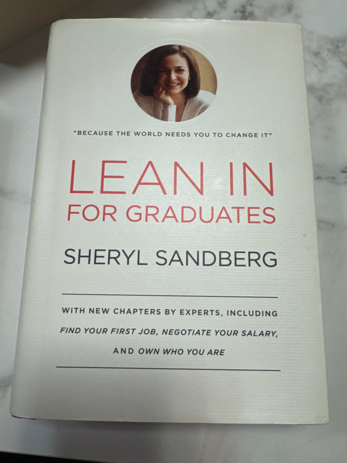 Lean in for graduates hardcover book by Sheryl Sandberg with red title text on white cover