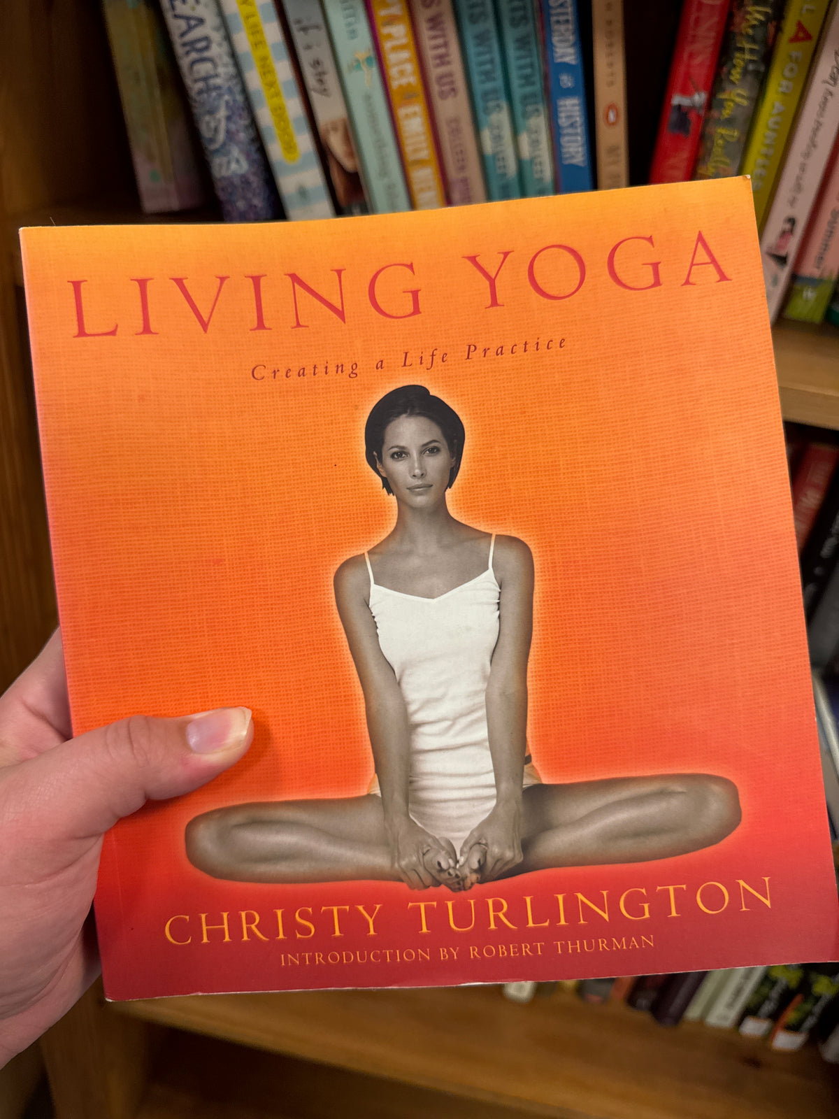 Living Yoga hardcover book by Christy Turlington with orange gradient cover