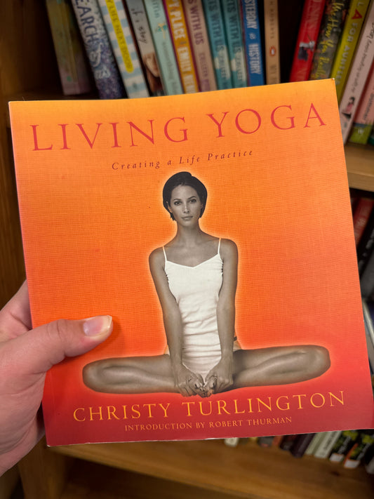 Living Yoga hardcover book by Christy Turlington with orange gradient cover