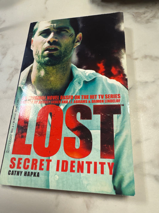 Lost Secret Identity paperback book by Cathy Hapka, TV series novel cover with man in blue shirt