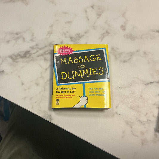 Book titled 'Massage for Dummies' on a marble surface