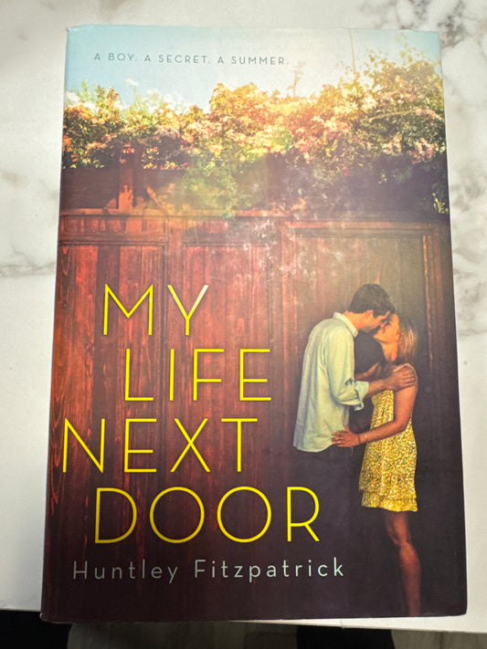 My Life Next Door hardcover book by Huntley Fitzpatrick with couple kissing fence cover art
