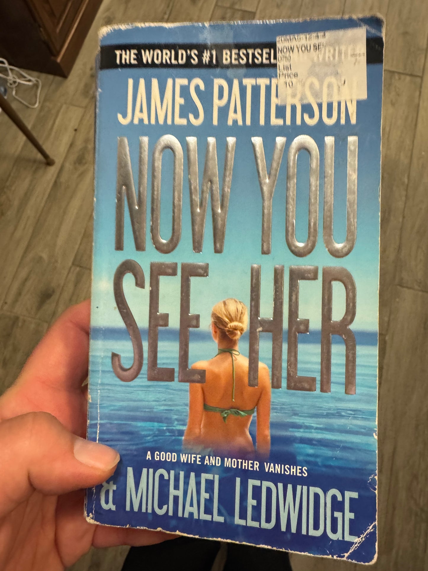 Now You See Her paperback thriller novel by James Patterson and Michael Ledwidge, featuring a woman in a green bikini on the cover
