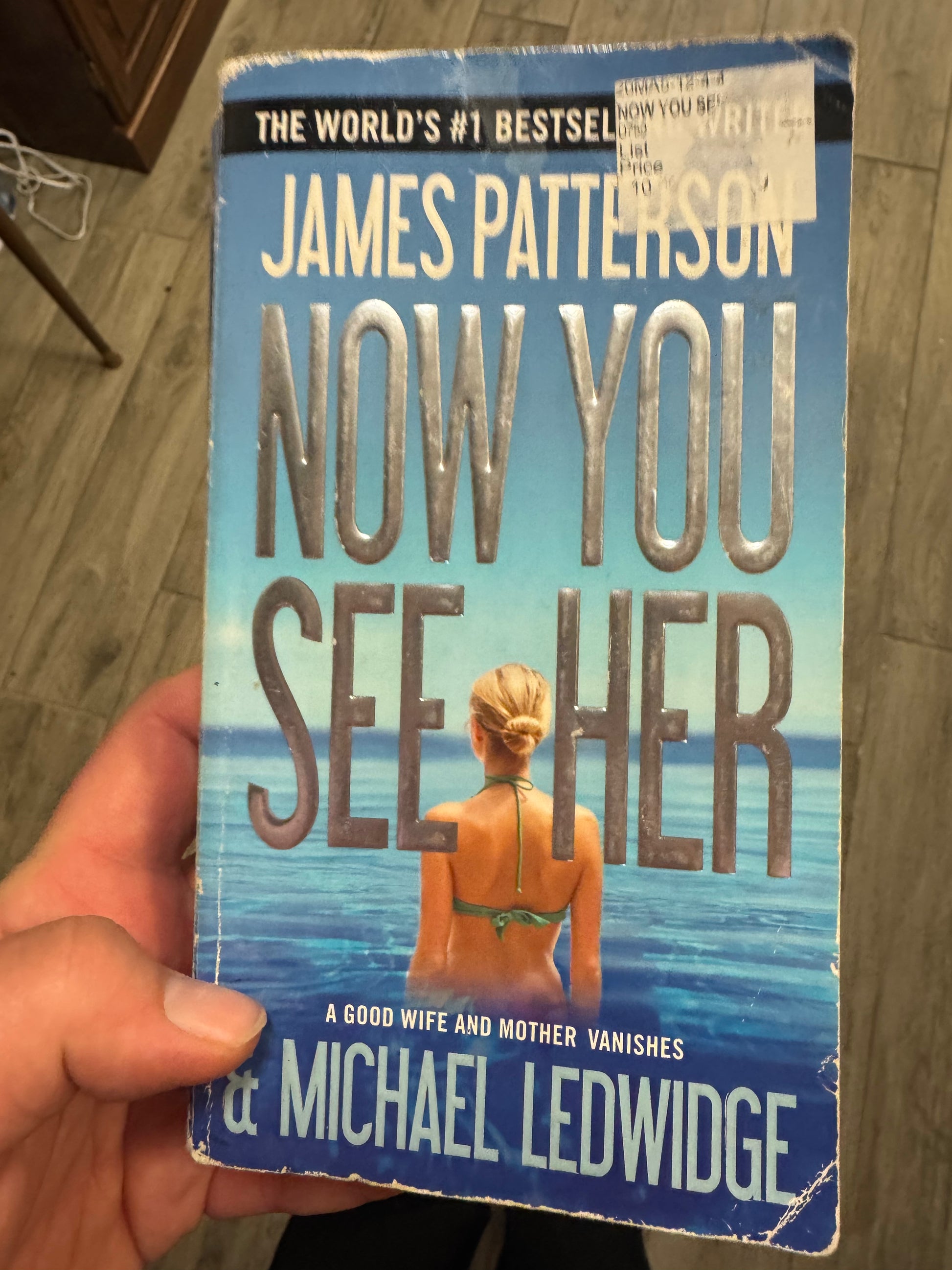 Now You See Her paperback thriller novel by James Patterson and Michael Ledwidge, featuring a woman in a green bikini on the cover