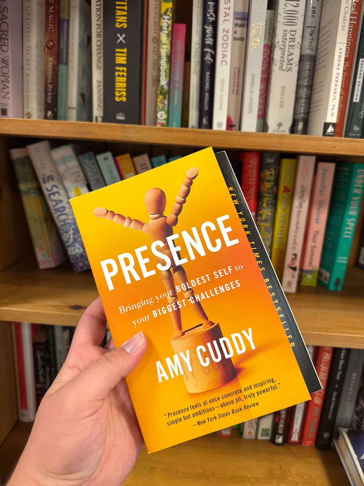 Presence book by Amy Cuddy with orange cover and wooden mannequin design