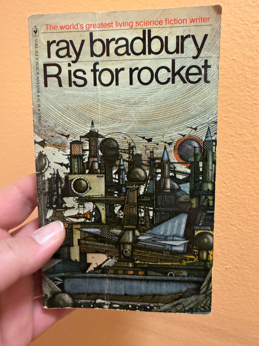 Vintage paperback copy of Ray Bradbury's R is for rocket with retro sci-fi cover art