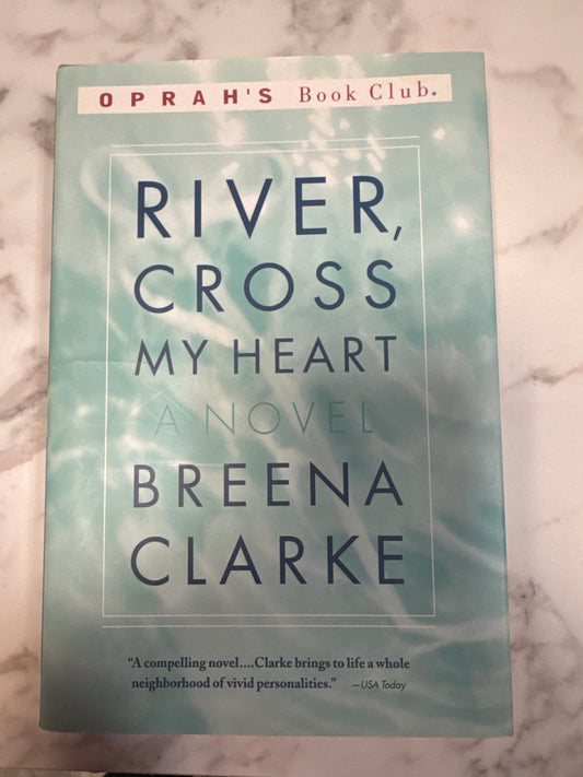River, Cross My Heart hardcover novel by Breena Clarke with teal water-ripple cover and Oprah's Book Club banner