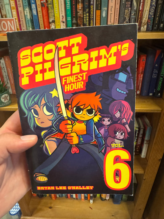 Scott Pilgrim Vol. 6 graphic novel by Bryan Lee O'Malley held in hand