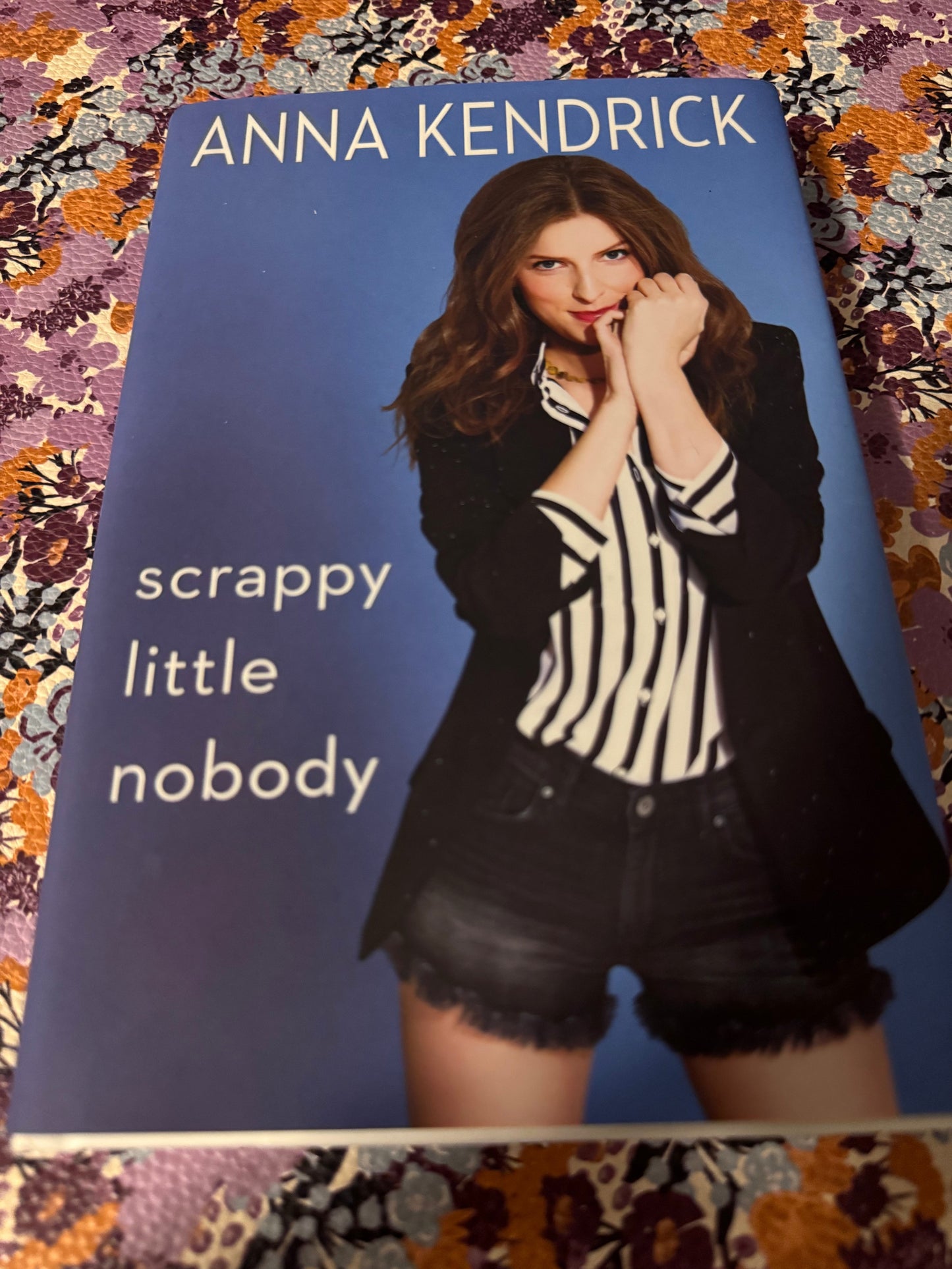 Scrappy Little Nobody hardcover book by Anna Kendrick with blue cover and author photo