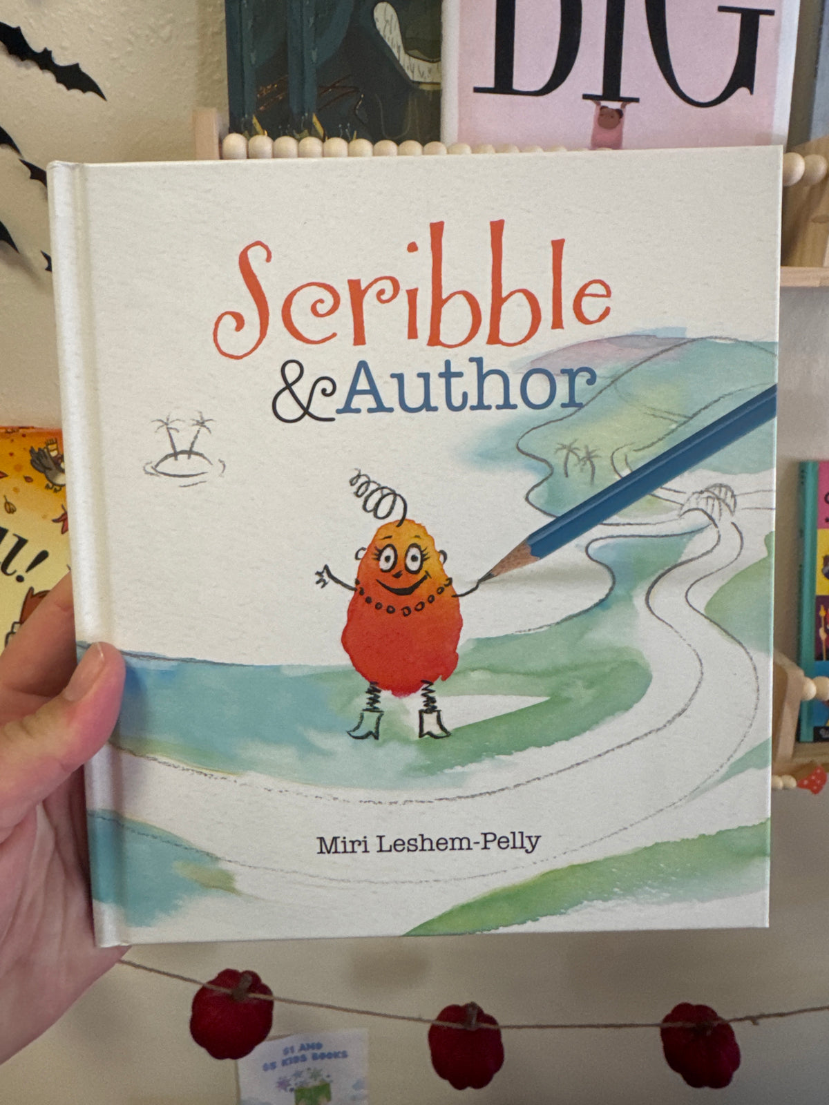 Scribble & Author children's book by Miri Leshem-Pelly, orange hardcover with watercolor illustration