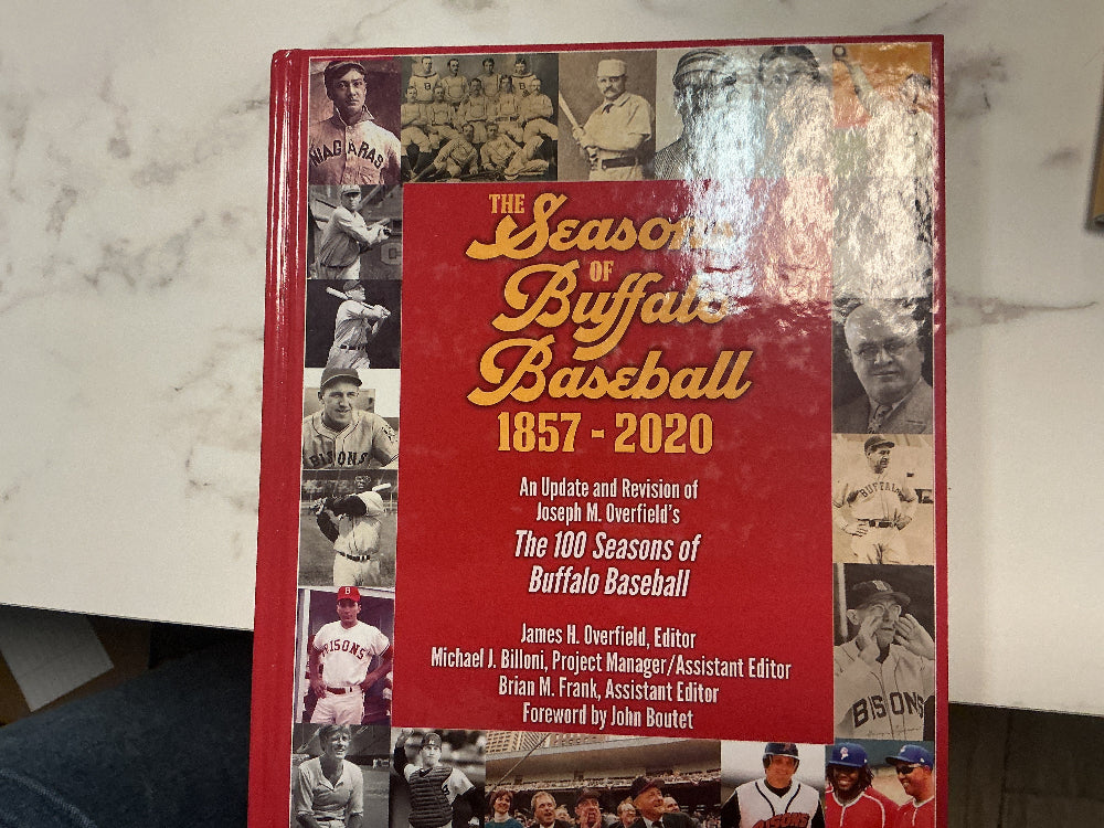 Book titled 'The Seasons of Buffalo Baseball 1857-2020' on a marble surface.