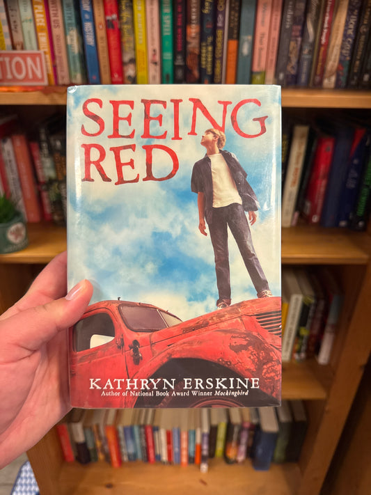 Seeing Red hardcover book by Kathryn Erskine with boy on red truck cover art