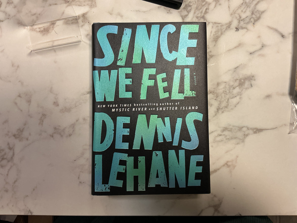 Since We Fell hardcover book by Dennis Lehane with teal gradient cover on marble