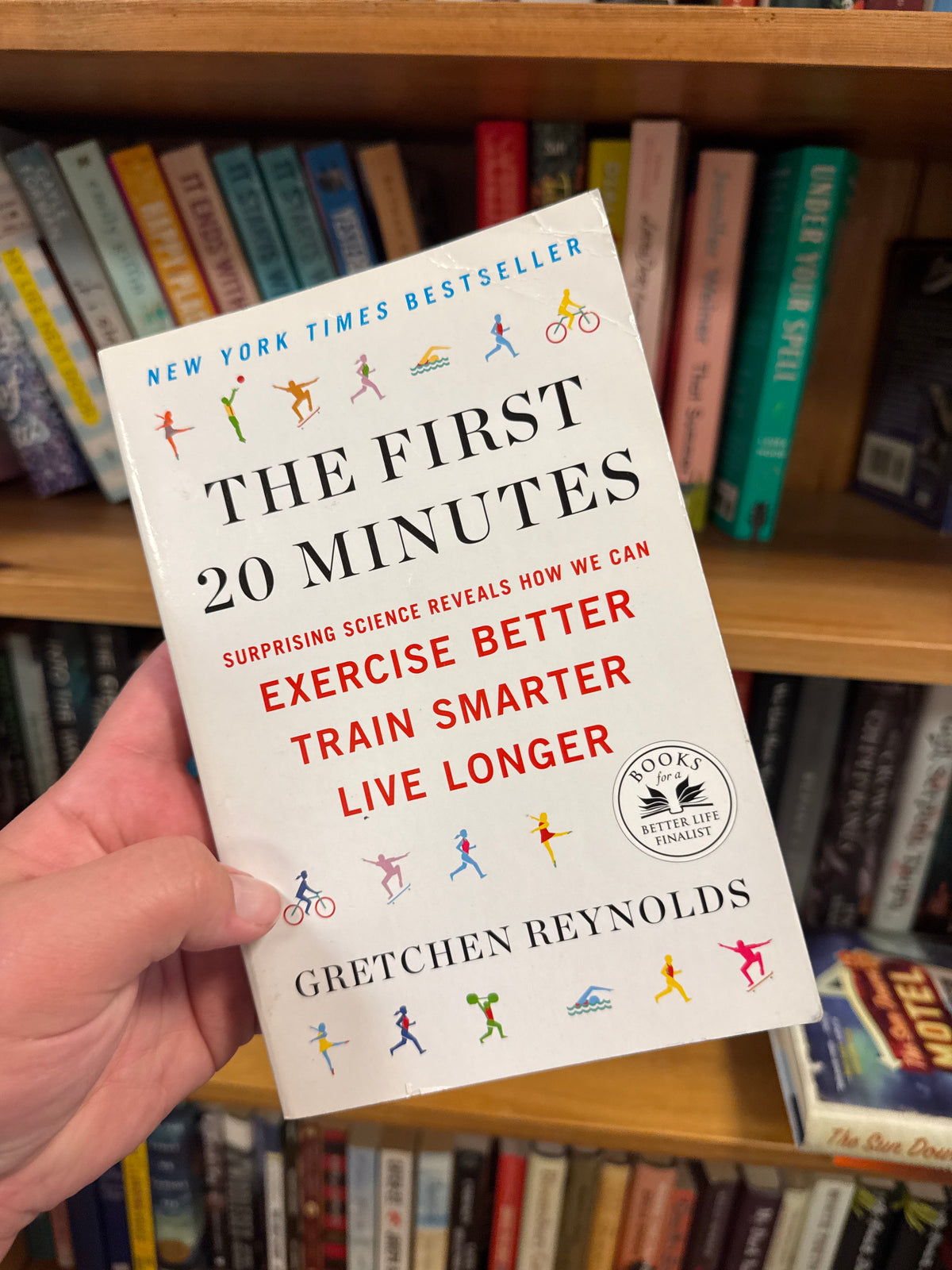The First 20 Minutes paperback book by Gretchen Reynolds held in hand
