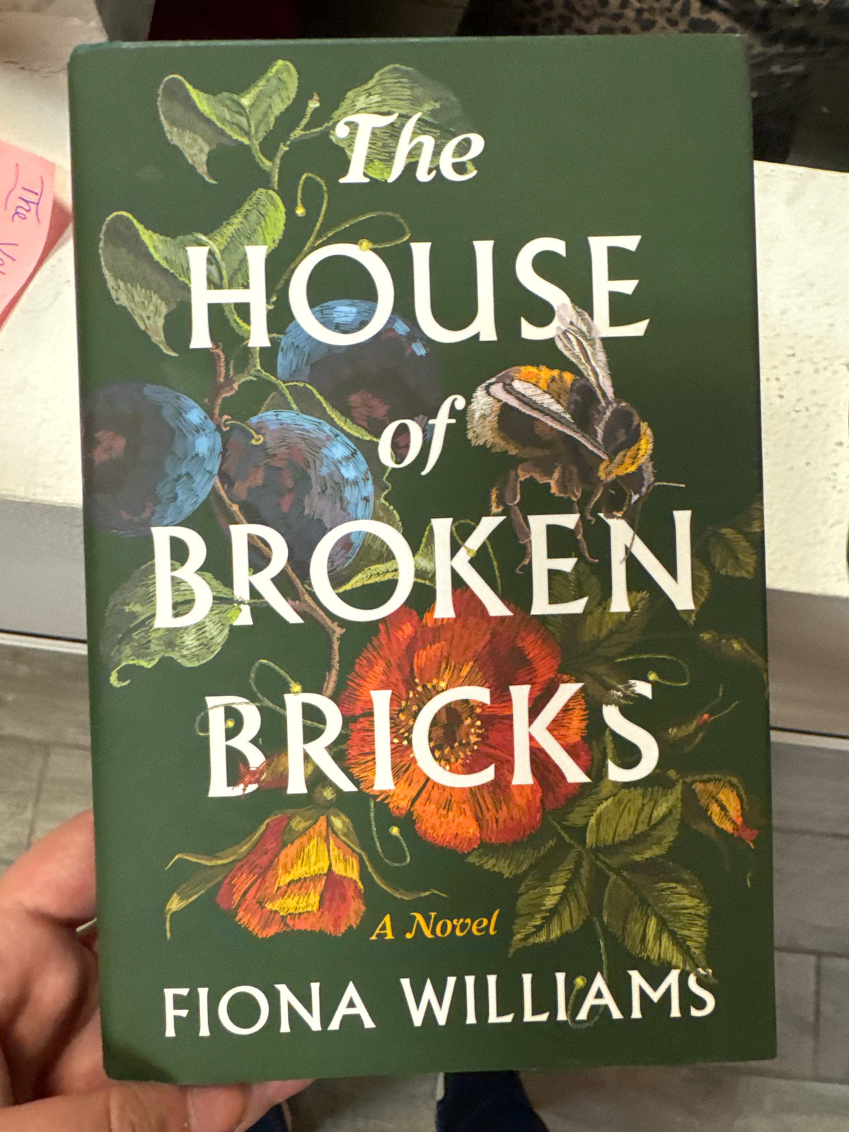 The House of Broken Bricks hardcover novel by Fiona Williams with blue berry and bumblebee cover art