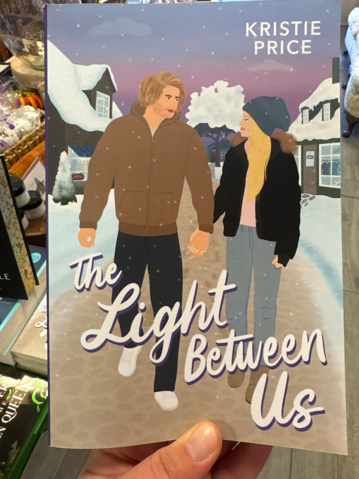 The Light Between Us romance novel by Kristie Price illustrated cover