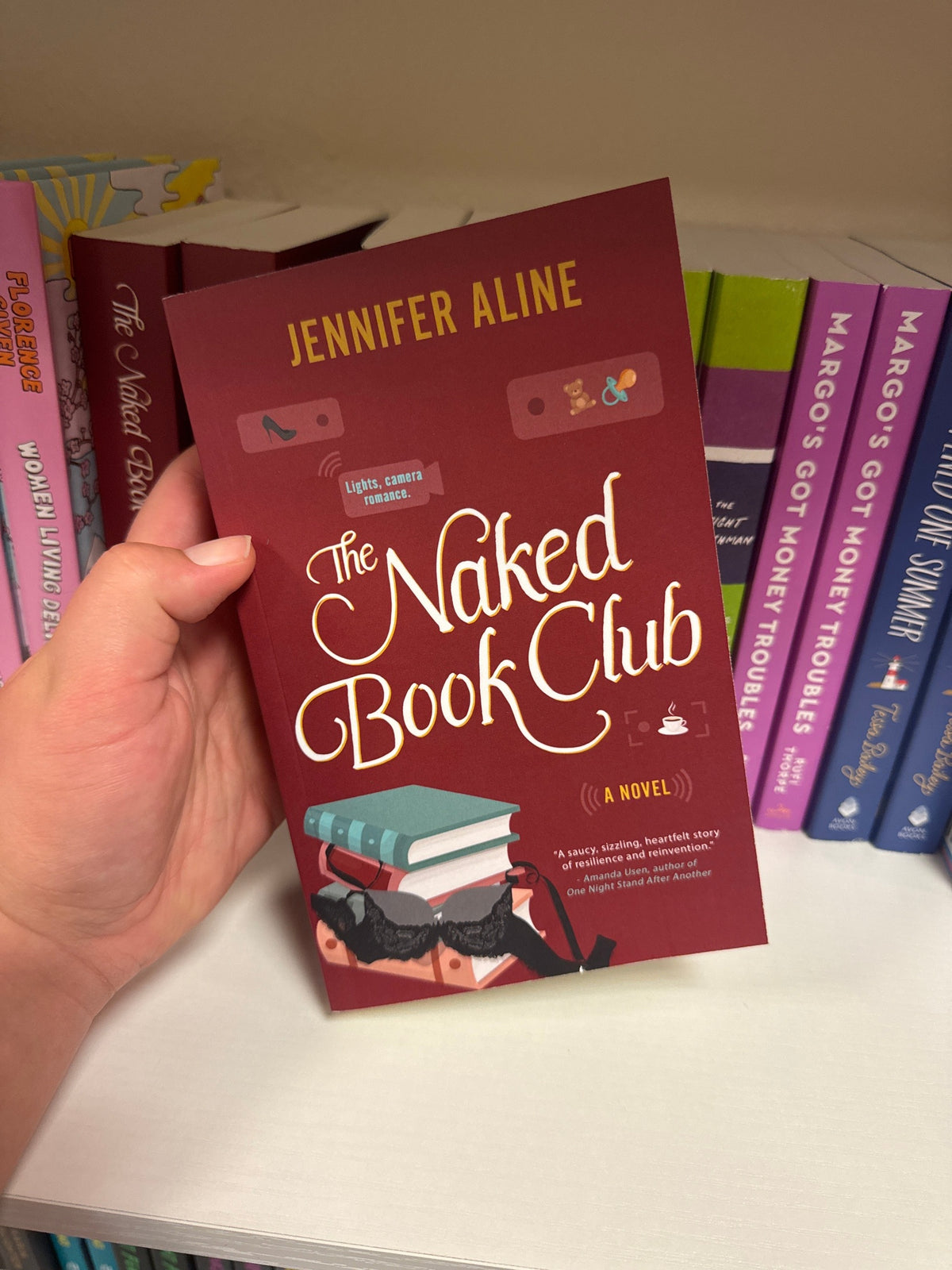 The Naked Book Club paperback by Jennifer Aline, maroon cover with lace lingerie and high heel illustration