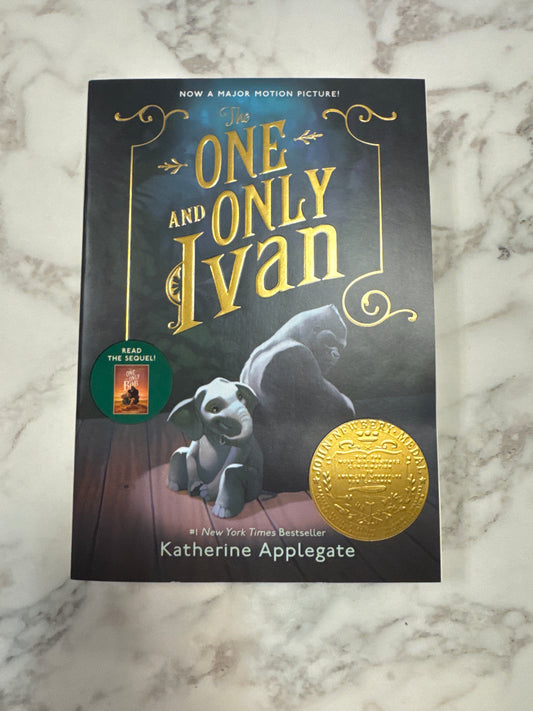 The One and Only Ivan hardcover book by Katherine Applegate with gold title text and elephant illustration