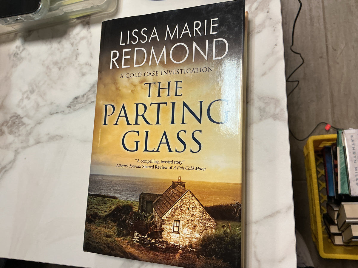 The Parting Glass hardcover book by Lissa Marie Redmond, ocean cottage cover art
